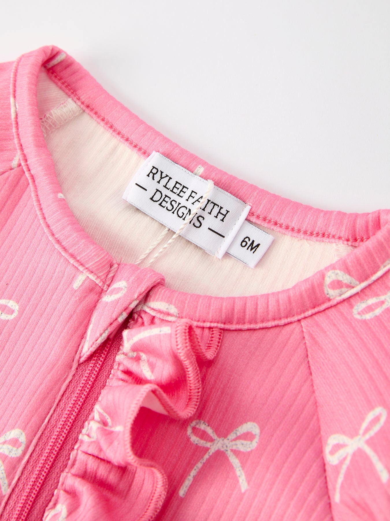 Christmas Bow Pink Romper with Hat: Sweet and Stylish Baby Outfit