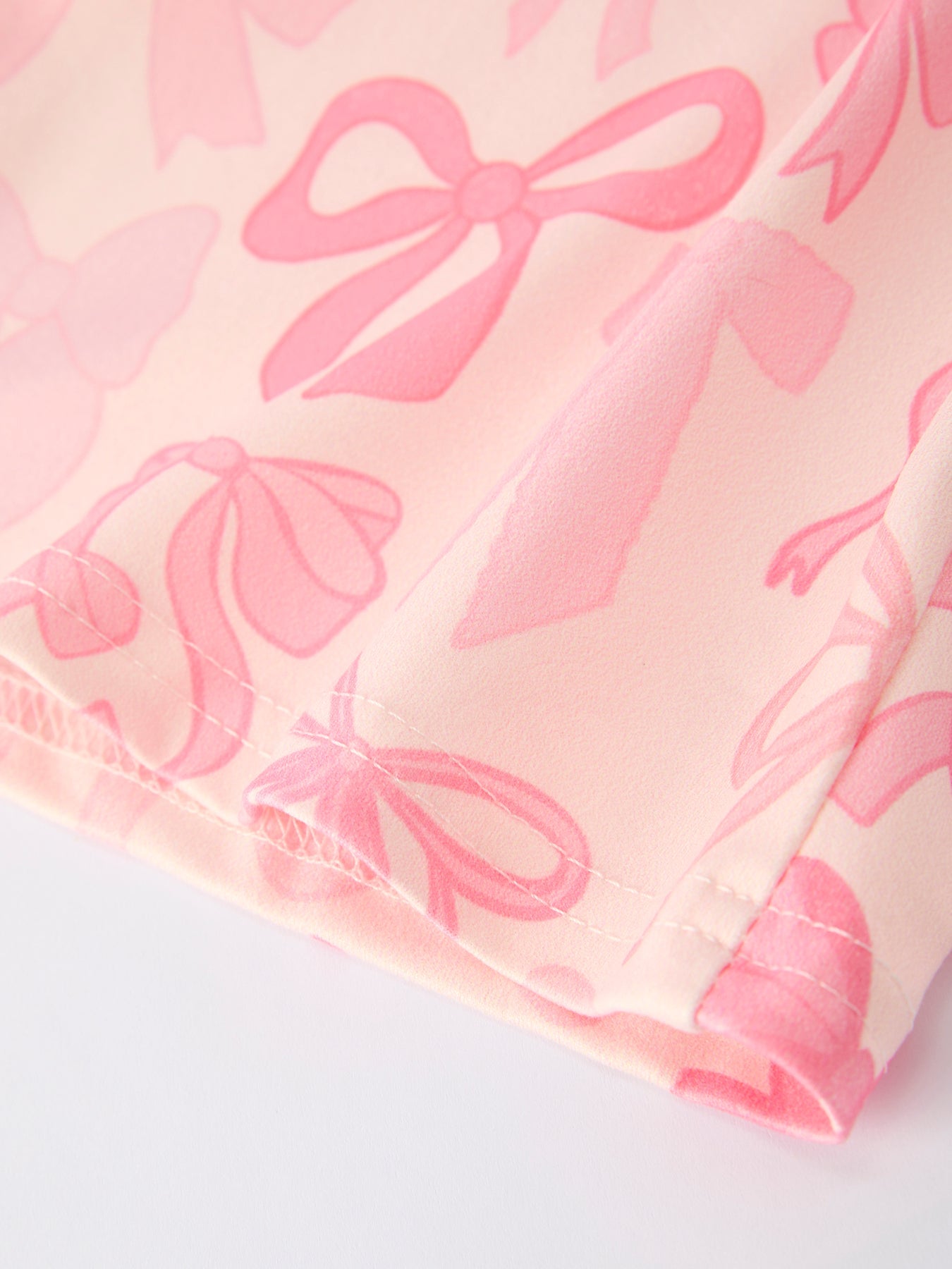 Girls Pink Bow Print Long Sleeve Jumpsuit